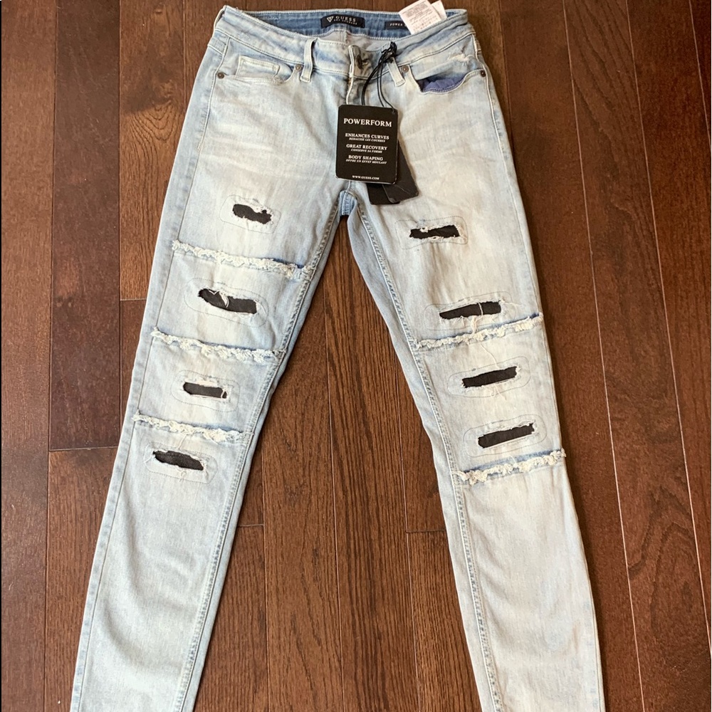 New jeans with holes light colored.